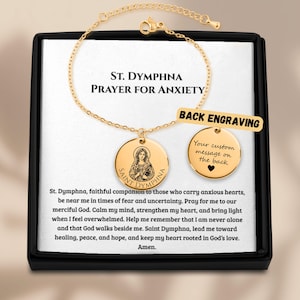 May include: A gold-toned chain bracelet featuring a circular pendant engraved with an image of Saint Dymphna and the text Saint Dymphna. A second circular charm displays the text Your custom message on the back with a heart symbol.