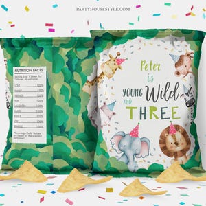 May include: Chip bag favour with a green camouflage pattern and a white label. The label has a jungle animal theme with a giraffe, elephant, lion, zebra, and monkey. The text on the label reads "Peter is Young and Wild Three".