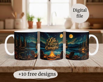 May include: White ceramic mug with a wraparound design featuring a campfire scene under a starry night sky. The text "Life is better by the campfire" is displayed. The mug has a white handle and is on a wooden surface.