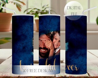 May include: A cylindrical tumbler featuring a dark blue textured background with a photographic print of a smiling child covering a man's eyes. The text "best dad ever" is written in gold script at the bottom, and a white circle reads "DIGITAL FILE".