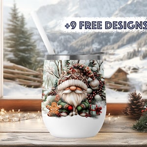 May include: White stainless steel tumbler with a winter scene featuring a gnome, gingerbread man, and pine trees. The tumbler has a lid and a straw. The text " +9 FREE DESIGNS" is visible in the background.