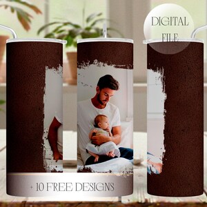 May include: A brown tumbler featuring a photograph of a man and a baby. The design includes a white brushstroke effect and the text "+ 10 FREE DESIGNS". It has a silver straw and a clear lid. The words "DIGITAL FILE" are on the lid.