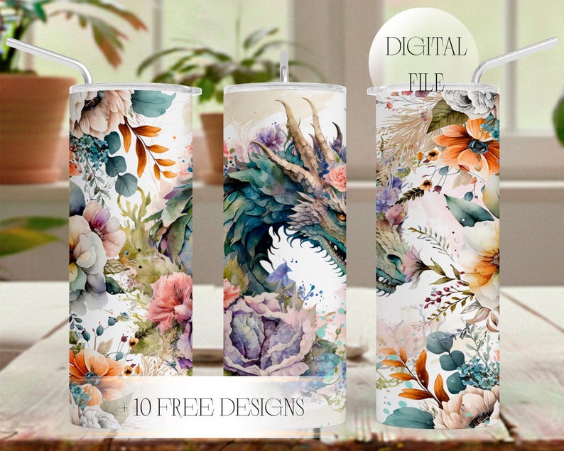 May include: Three cylindrical tumblers with straws, featuring a watercolor print of a green dragon surrounded by orange, pink, and blue flowers and foliage. The text DIGITAL FILE and 10 FREE DESIGNS is printed on the image of the tumblers.