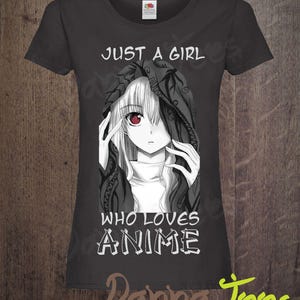 May include: A black t-shirt featuring a white graphic of an anime girl with red eyes and the text "Just a girl who loves anime".