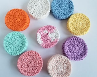 May include: Nine crocheted cotton rounds in various colors, including white, light blue, yellow, orange, pink, and green. The rounds are arranged in a circle on a white background.