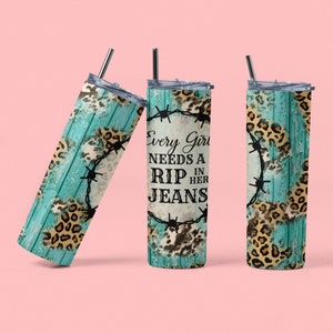 May include: Three stainless steel insulated tumblers with lids and straws. The tumblers feature a turquoise wood grain design with leopard print accents and barbed wire. The text on the center tumbler reads "Every Girl Needs a Rip in Her Jeans."