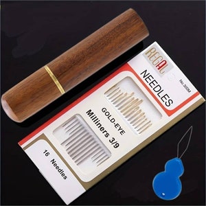 May include: A set of 16 gold-eye milliners needles in a wooden case with a needle threader. The packaging is red and white and says "Regal Needles No. 300M Gold-Eye Milliners 3/9 16 Needles".
