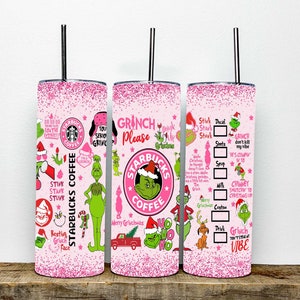 May include: Pink glitter tumbler with a Grinch and Starbucks Coffee theme. The tumbler features a green Grinch character, a red truck, and the words "Grinch Please" and "Starbucks Coffee".