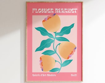 May include: A pink poster with the text "FLOWER MARKET" in white letters. The poster features a stylized illustration of a yellow flower with green leaves on a pink background. The text "Galerie d'Art Modern" and "No.21" are at the bottom of the poster.