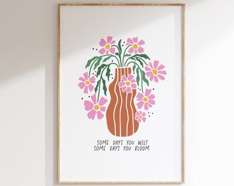 May include: A white background with a brown vase with pink flowers and green stems. The text "Some days you wilt some days you bloom" is below the vase.