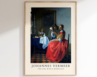 Può includere: Una stampa incorniciata del dipinto di Johannes Vermeer "La ragazza con un bicchiere di vino". Il dipinto raffigura tre figure in una stanza con un pavimento a scacchi. La donna al centro indossa un vestito rosso e tiene un bicchiere di vino.