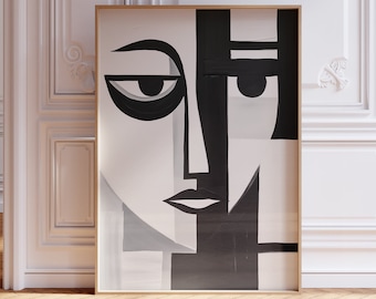May include: A black and white abstract art print of a face with geometric shapes. The print is framed in a light wood frame.