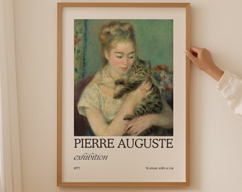 May include: A framed poster with a painting of a woman holding a cat. The poster has the text "PIERRE AUGUSTE exhibition" and "Woman with a Cat" at the bottom.