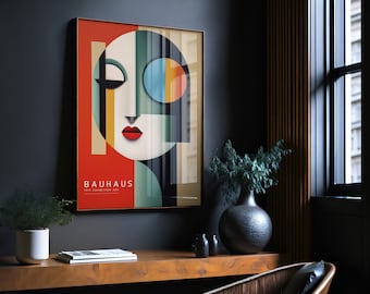 May include: A framed poster with a geometric design in red, yellow, blue, green, and black. The poster features a stylized face with a red mouth and a blue eye. The text "BAUHAUS 1919 EXHIBITION ART" is printed at the bottom of the poster.