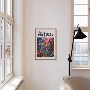 May include: A framed print of a painting by Henri Matisse featuring colorful parrots in a jungle setting.