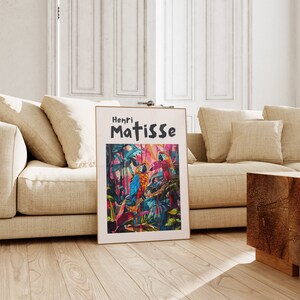 May include: A framed print of a painting by Henri Matisse featuring three colorful parrots in a jungle setting. The title of the artwork is "Henri Matisse".