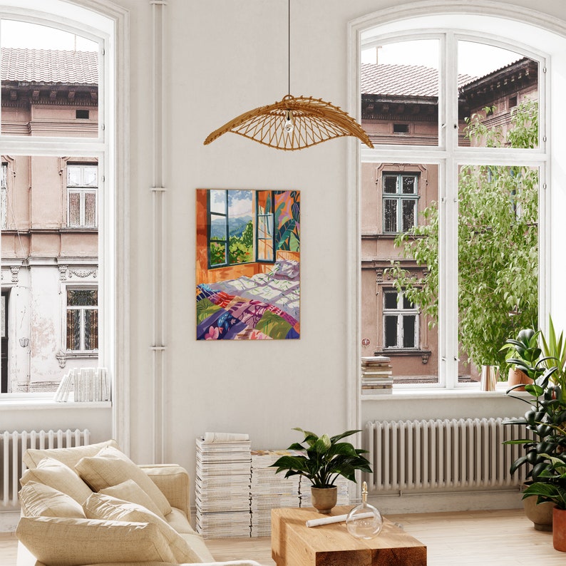 May include: A colorful painting of a bedroom with a window overlooking a green landscape. The bed is covered in a patchwork quilt and there are pillows on the bed. The painting is framed and hanging on a white wall.