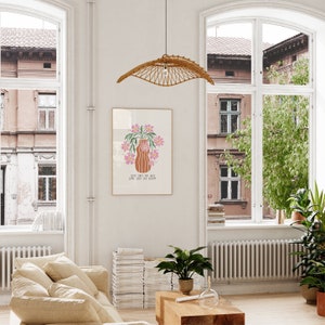 a living room filled with furniture and large windows