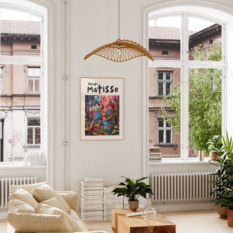 May include: A framed poster with a colorful painting of birds in a jungle setting. The poster has the text "Henri Matisse" at the top.