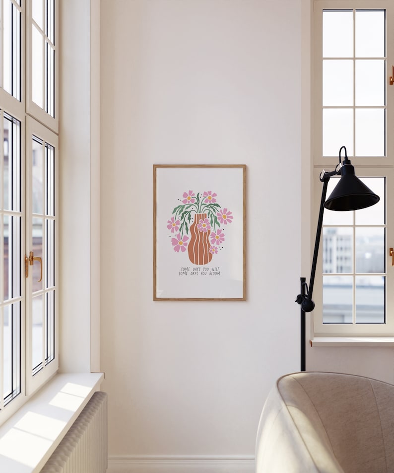 a picture hanging on a wall next to a window