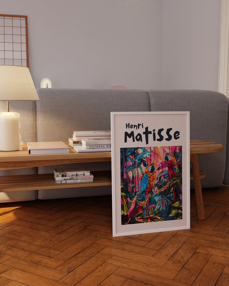 May include: A framed print of a painting by Henri Matisse featuring three colorful parrots in a jungle setting. The title of the painting is "Henri Matisse".