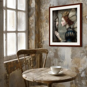 May include: A framed artwork depicts a woman with a crown and wings looking into a mirror. The artwork is in a dark brown frame and hangs on a textured wall. A wooden table with a teacup and saucer sits in front of a window.