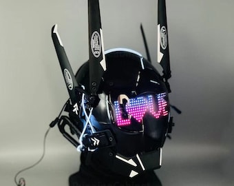 May include: A black helmet with two black propellers on top and a light-up display that says "LOVE" in pink and blue lights. The helmet is on a black stand with the words "RunningCabinet" printed on it.