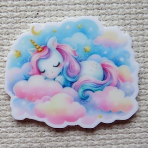 May include: A white unicorn with a rainbow mane and tail sleeps on a pink and blue cloud with stars and a crescent moon in the background.