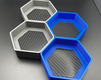 stackable board game token piece tray organizer with a carbon fiber pattern.