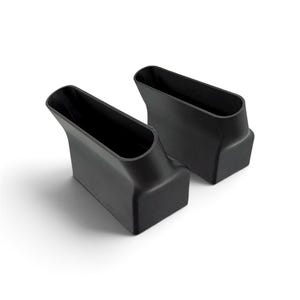 May include: Two black, hollow, rectangular-based attachments with an angled, elongated top opening. These components feature a smooth, matte finish and a tapered design, narrowing from the base toward the top, constructed from a solid, dark material.