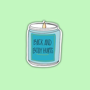 May include: A sticker of a light blue candle with a white lid and a yellow flame. The candle has a teal label with the words "BACK AND BODY HURTS" in black script. The sticker is outlined in white and set against a light green background.