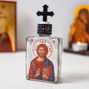 Holy Water Glass Bottle  with Jesus Christ icon engraved on the glass and screw cap .