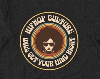 May include: Black t-shirt with a retro-style graphic of a woman with an afro wearing sunglasses. The graphic says "Hiphop Culture Will Get Your Mind Right".