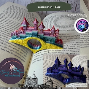 May include: Colorful castle-shaped bookmarks. One is rainbow-colored, the other is blue. The bookmarks are placed on an open book. The text "Lesezeichen - Burg" is at the top. The design is by Craft Kid 3.