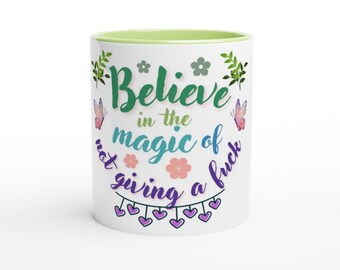 Believe in the magic of not giving a f*** coffee mug