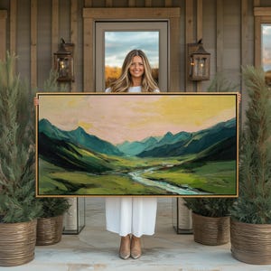 May include: A white ceramic mug with a black handle and the text "But First, Coffee" in a black, bold font. The mug is on a white surface. The mug is approximately 10 cm tall.
