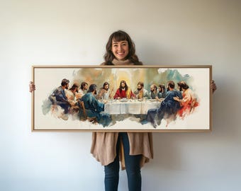 May include: A framed watercolor painting depicting Jesus and his disciples at the Last Supper. The painting is in a light wood frame and features a warm color palette.