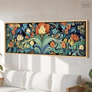 May include: A framed canvas print featuring a colorful floral design with intricate details. The design is a mix of blue, green, orange, and yellow hues, creating a vibrant and intricate pattern.