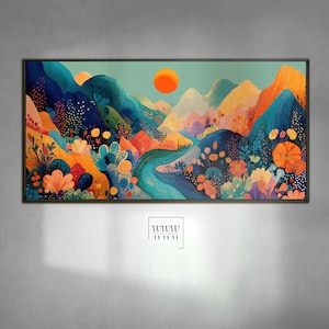 May include: A framed landscape art print featuring a vibrant, colorful mountain scene. The artwork showcases a bright orange sun, rolling hills in shades of blue, orange, and yellow, and a winding river. The overall theme is nature and landscape.