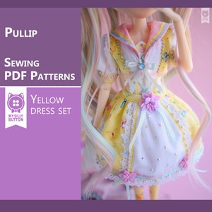 May include: A yellow and white dress set for a Pullip doll. The dress has a sailor collar, a white skirt with a yellow lace trim, and a yellow bodice with a floral print. The dress is decorated with white and pink flowers and a rhinestone.