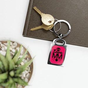 Rectangle Keyring Mary Magdalene logo, pink.