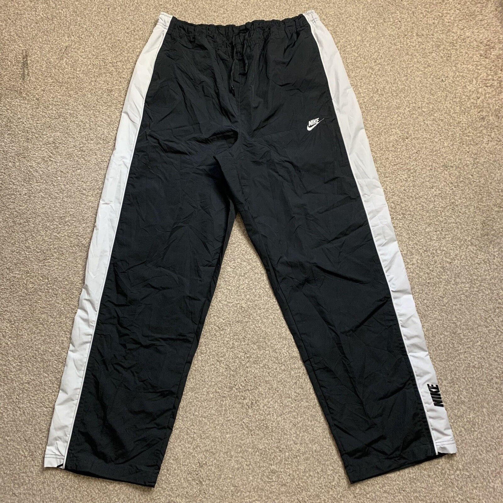 Y2k Nike track pants, Men's Fashion, Bottoms, Joggers on Carousell