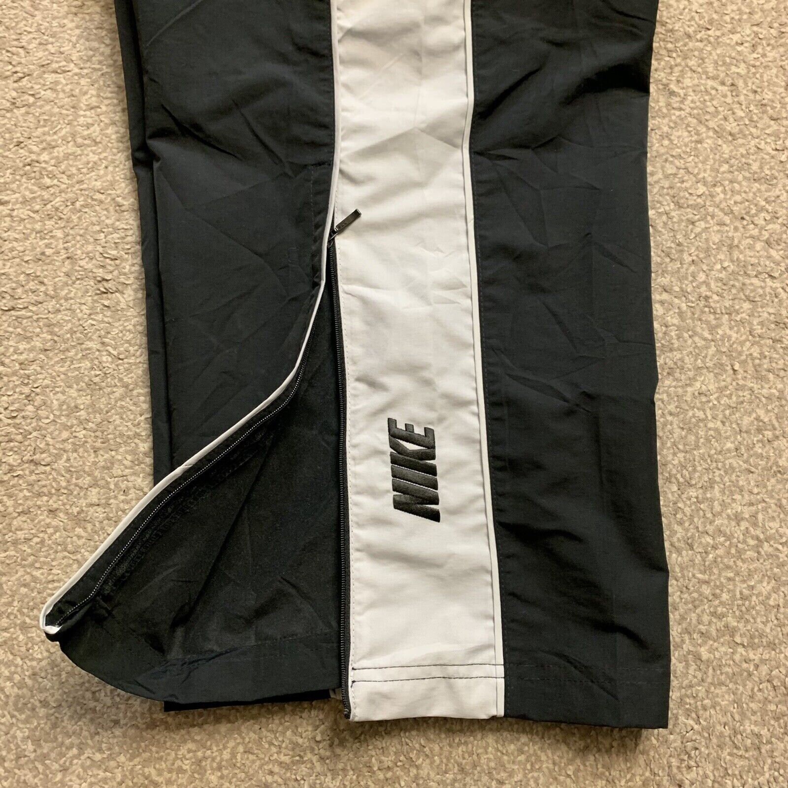 Y2k Nike track pants, Men's Fashion, Bottoms, Joggers on Carousell