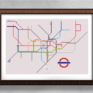 May include: A colourful map of the London Underground tube system with the iconic red circle logo. The map is framed in a dark brown wood frame.