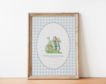 May include: Framed print featuring a watercolor illustration of Peter Rabbit with a watering can and a bunny. The artwork is set against a light blue and white gingham pattern. The text reads "For all things without complaining and arguing".