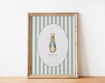 May include: Framed print featuring a watercolor illustration of Peter Rabbit in a blue jacket. The artwork is set against a green and white striped background, within a wooden frame. The text at the bottom reads, "Be stirring and courageous."