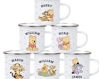 May include: White enamel mugs with silver rims, each displaying a different Winnie the Pooh character and name, such as "Henry" and "William." The mugs feature illustrations of Pooh, Tigger, Piglet, and Eeyore. Each mug has a handle.