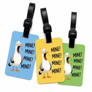 May include: Three luggage tags with black straps. Each tag has a cartoon seagull illustration with the word "MINE!" repeated multiple times. The tags are blue, yellow, and green.