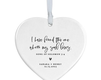 May include: White heart-shaped ceramic ornament with the text "I have found the one whom my soul loves."  "SONG OF SOLOMON 3:4"  "SAHARA + HENRY 12.15.2023"