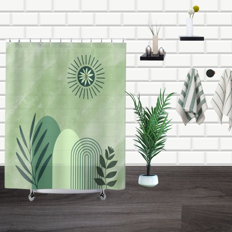 May include: A green shower curtain with a stylized sun, leaves, and abstract shapes. The curtain has a white background with a subtle watercolor effect.